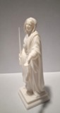 Profil gauche de la figurine de Sainte Restitude avec la main ouverte et le long manteau drapé figurine-sainte-restitude-corse-profil-gauche.jpg